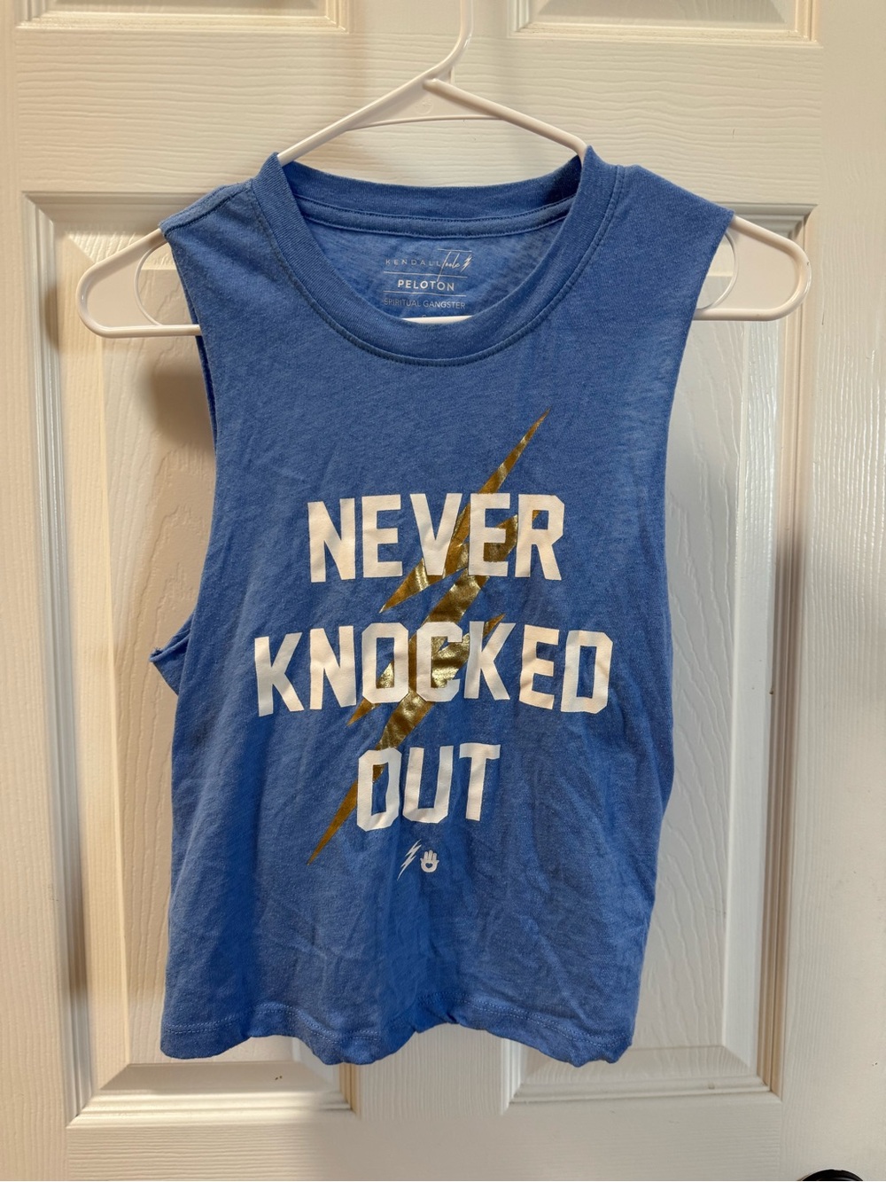 Spiritual Gangster & Peloton collab Blue Tank with White Text and Gold Lightning